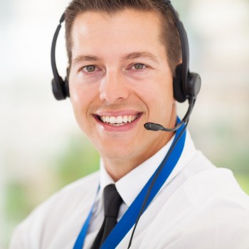 male call centre employee wearing a headset